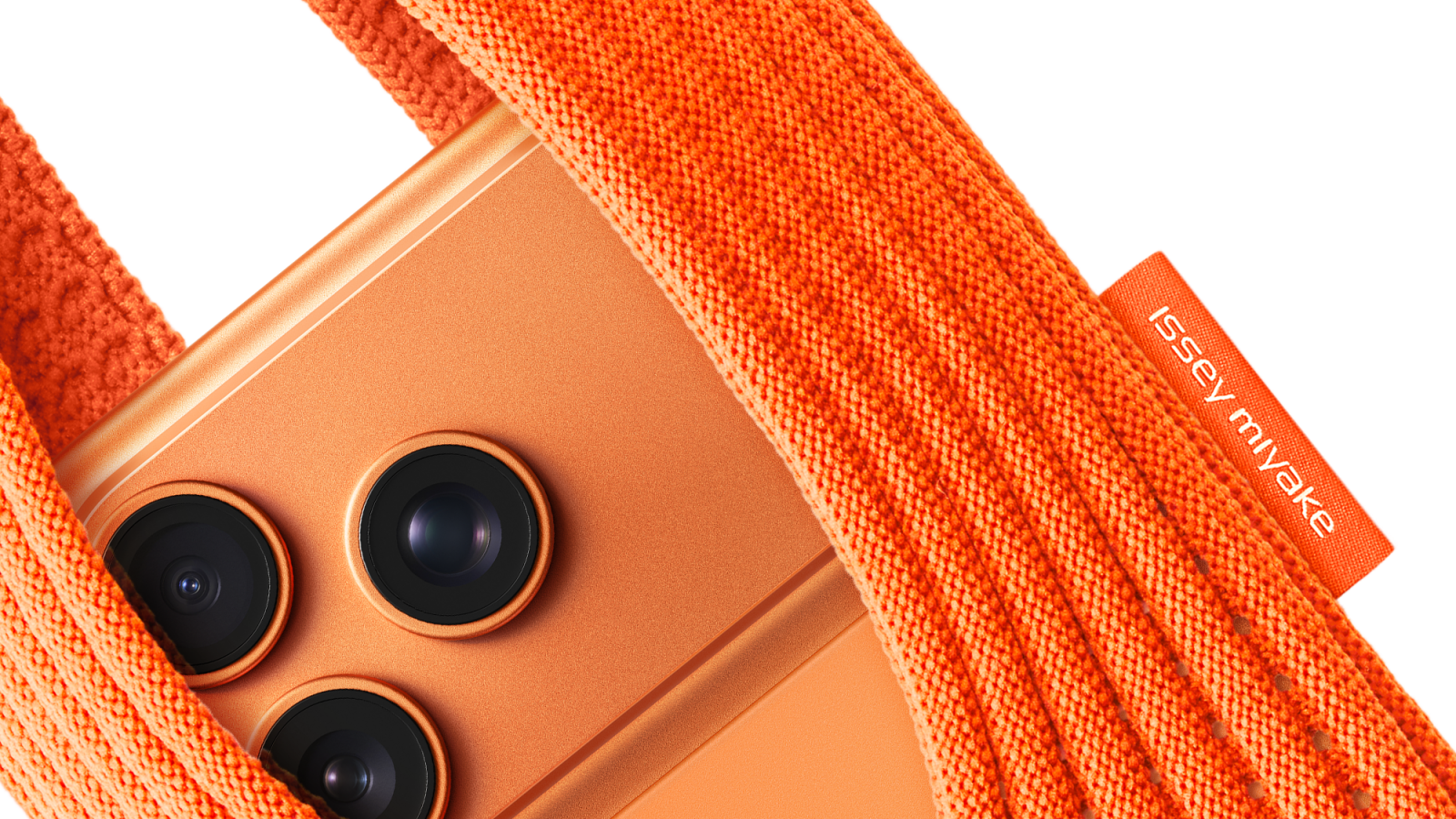 iPhone Pocket by ISSEY MIYAKE in mandarin with iPhone 17 Pro in Cosmic Orange.png